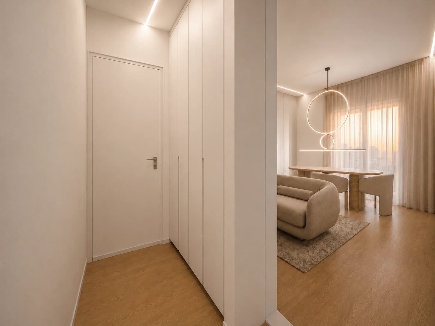 Ingresso dell’Appartamento 2 con armadiatura integrata e passaggio verso il living